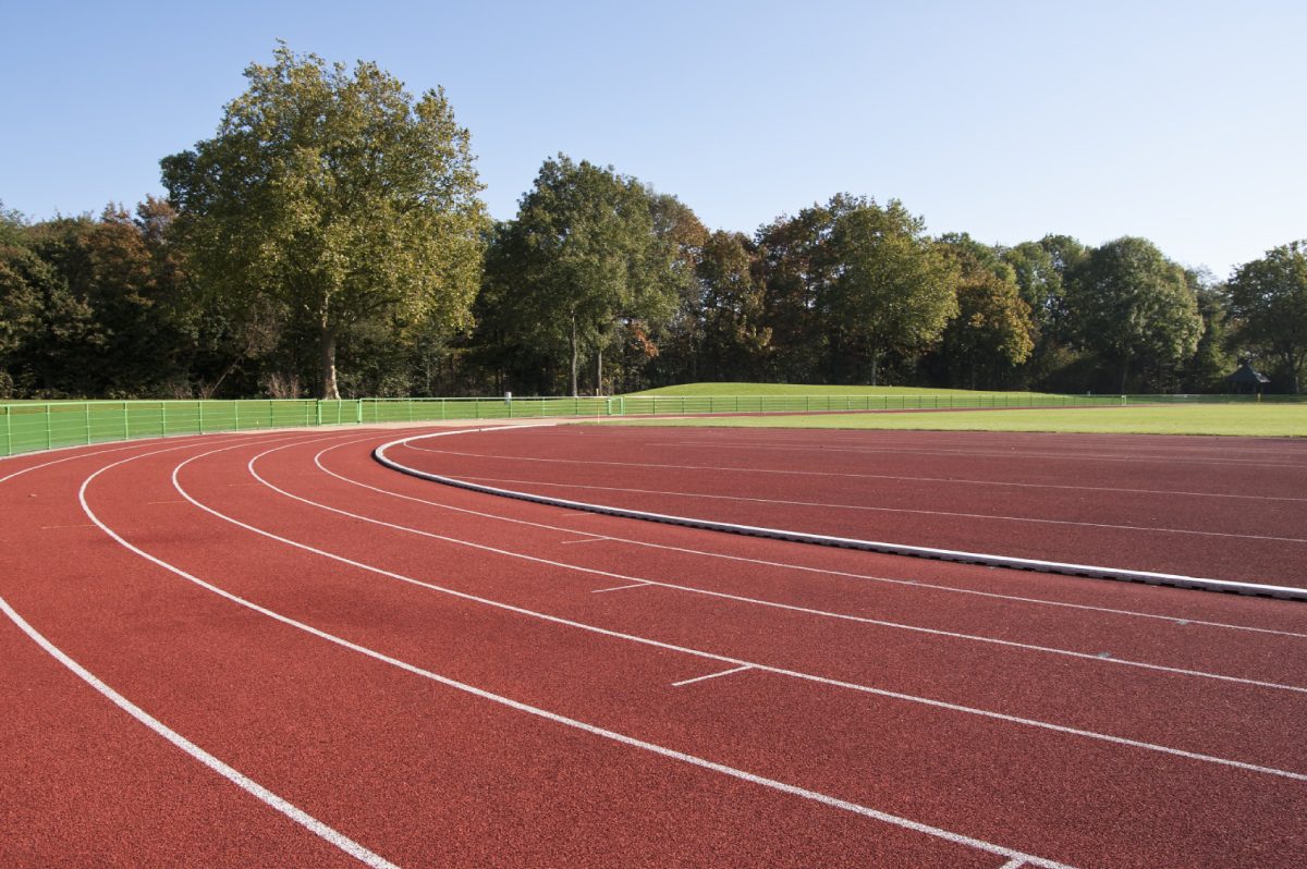 Outdoor running track with trees nearby.